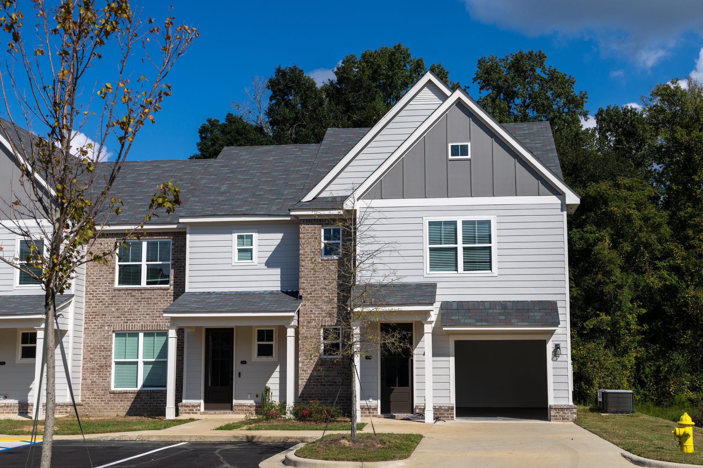 Front of an Everstead townhome with brick and siding