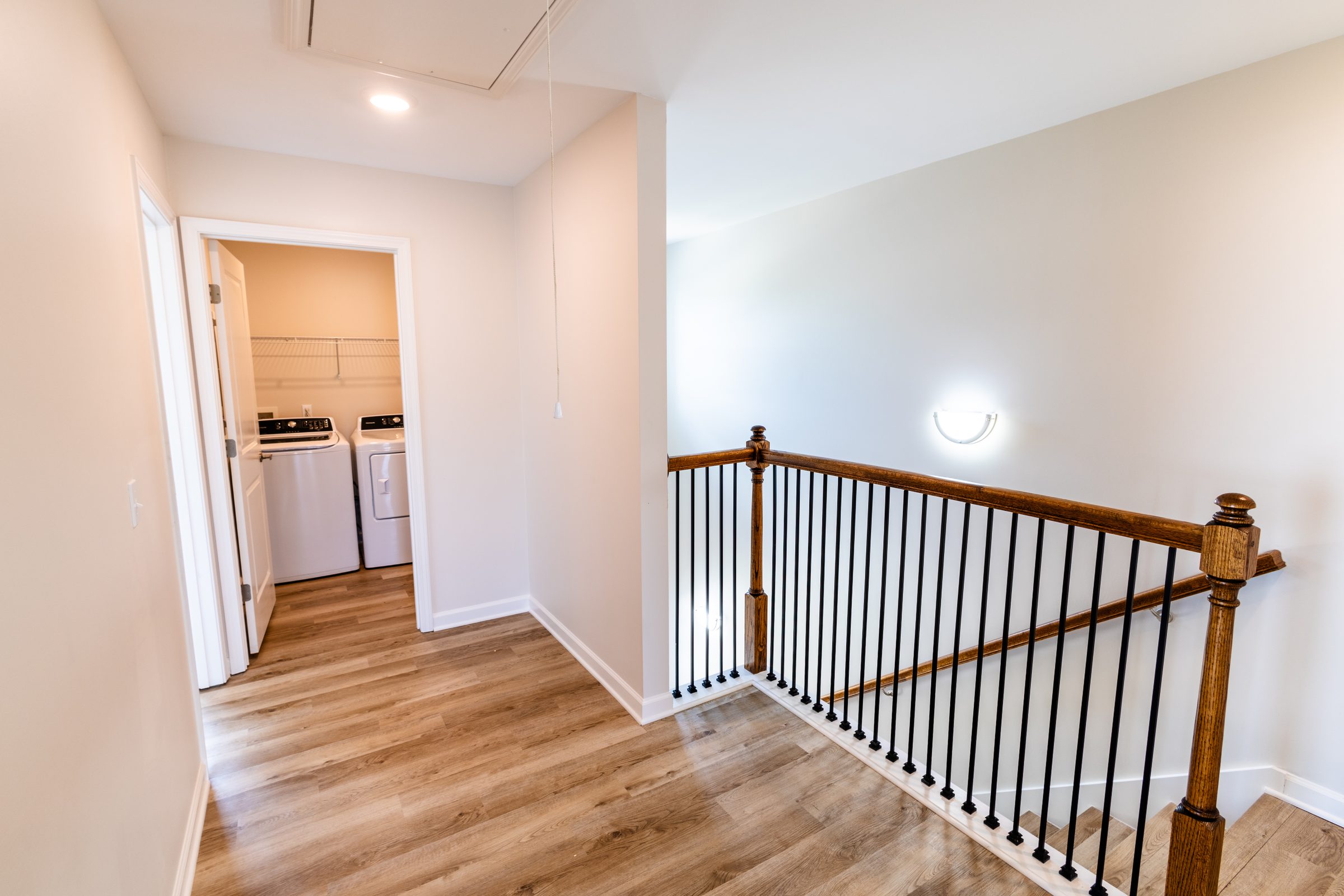 Upstairs landing with wood railing