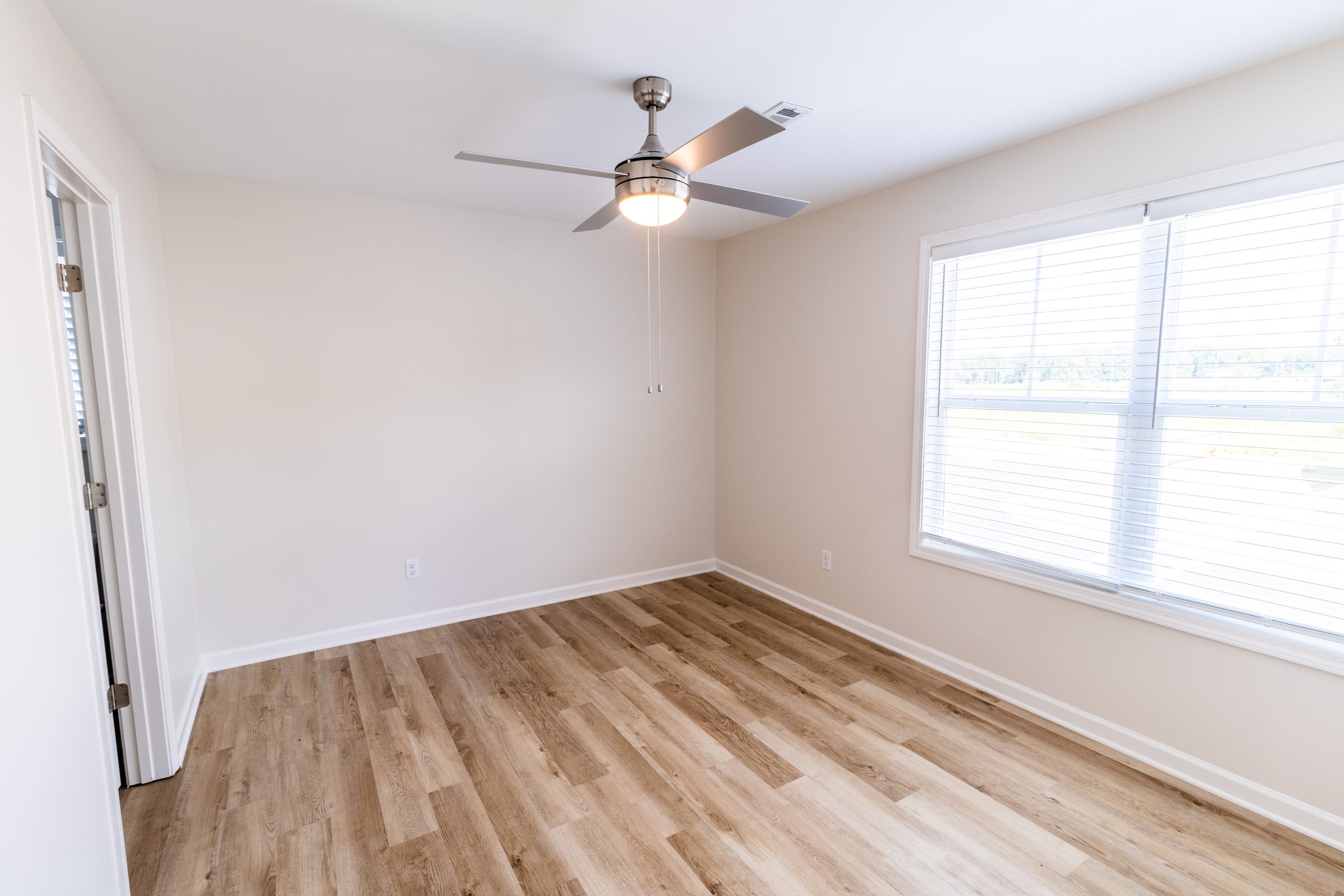 Bright bedroom with ceiling fan