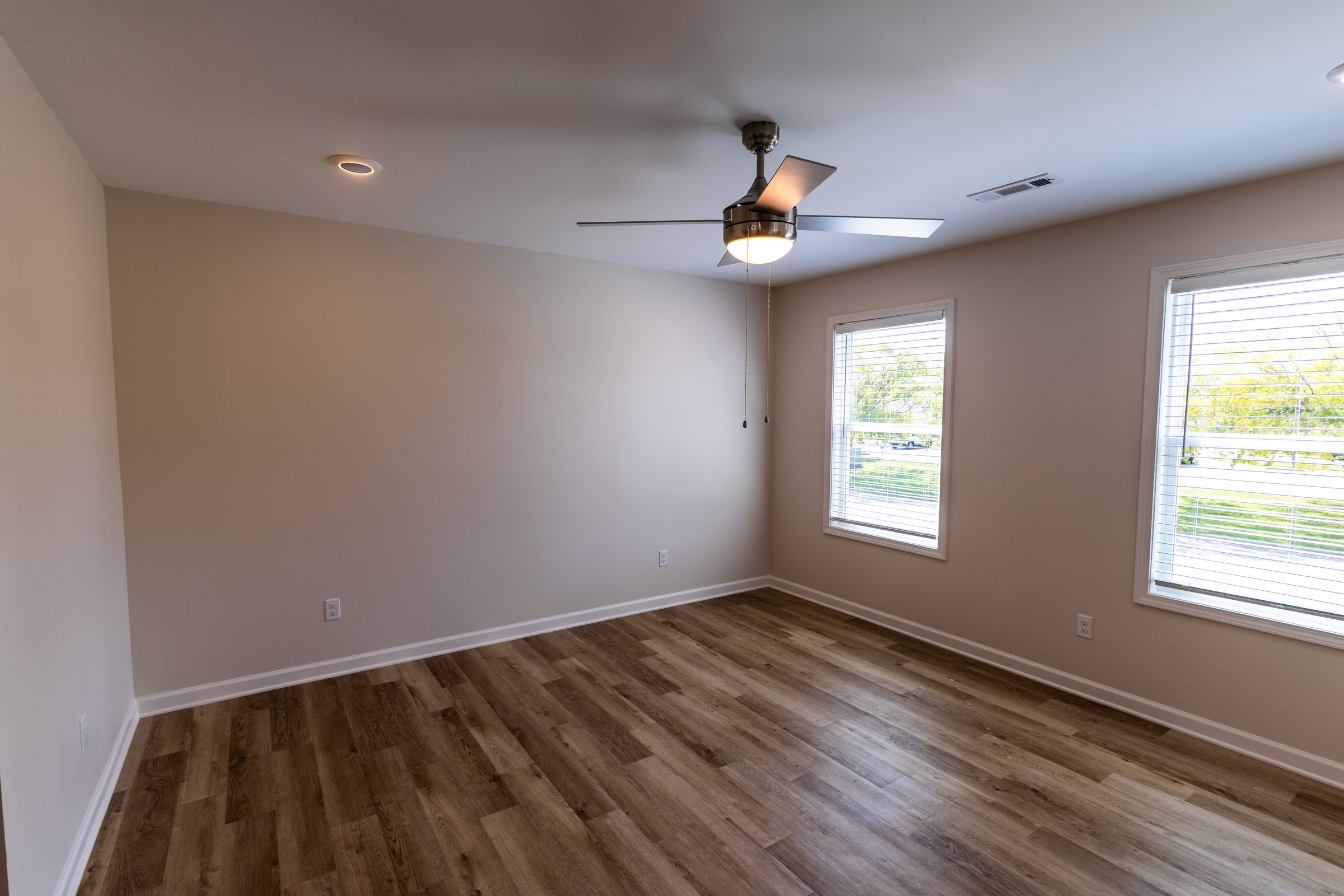 Spacious bedroom with two windows